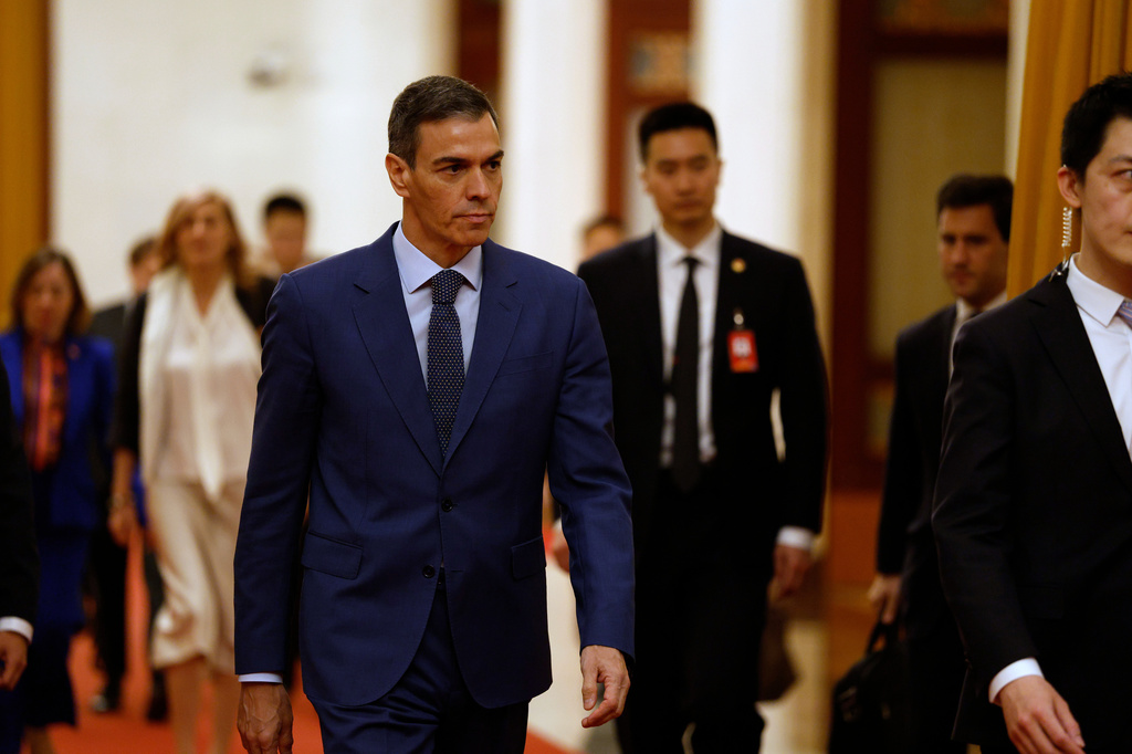 Spain's Prime Minister Pedro Sanchez, center, arrives for a meeting with China's President Xi Jinping, not pictured, at the Great Hall of the People in Beijing Tuesday, April 14, 2026. (Haruna Furuhashi/Pool Photo via AP)
