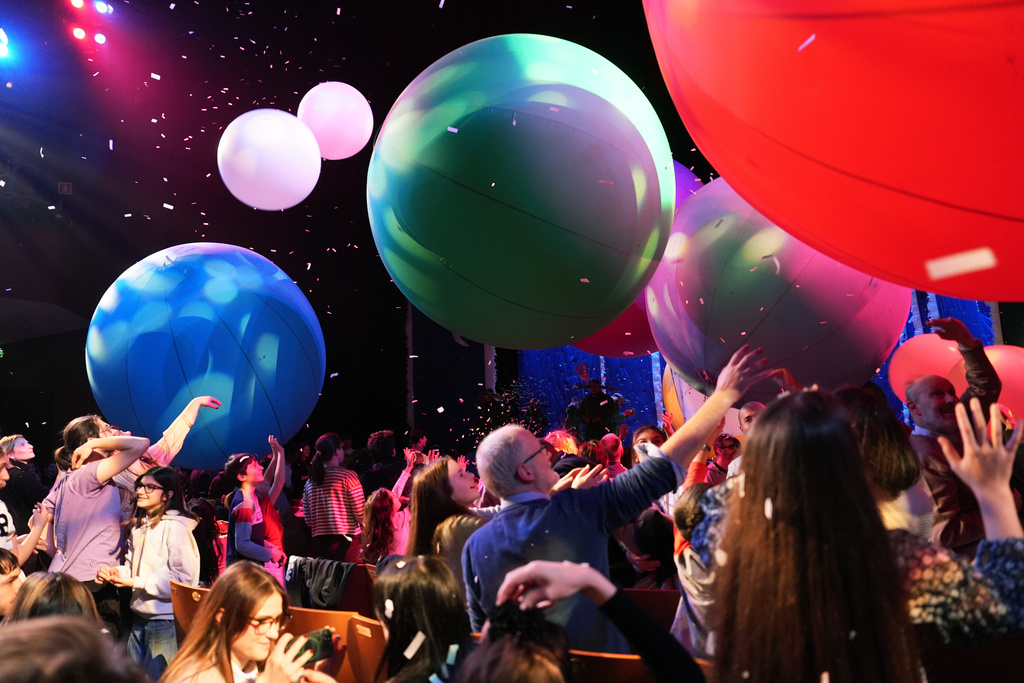 A view of paper snow and large balloons released during “Slava’s Snowshow” at Teatro Strehler, on the sidelines of the 2026 Winter Olympics, in Milan, Italy, Friday, Feb. 6, 2026. (AP Photo/María Teresa Hernández)
