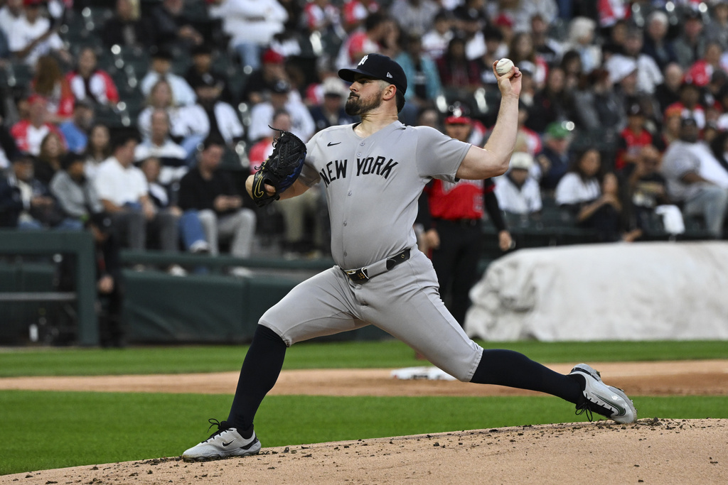 New York Yankees pitcher Carlos Rodón delivers during the first inning of a baseball game against the Chicago White Sox, Friday, Aug. 29, 2025, in Chicago. (AP Photo/Matt Marton)
