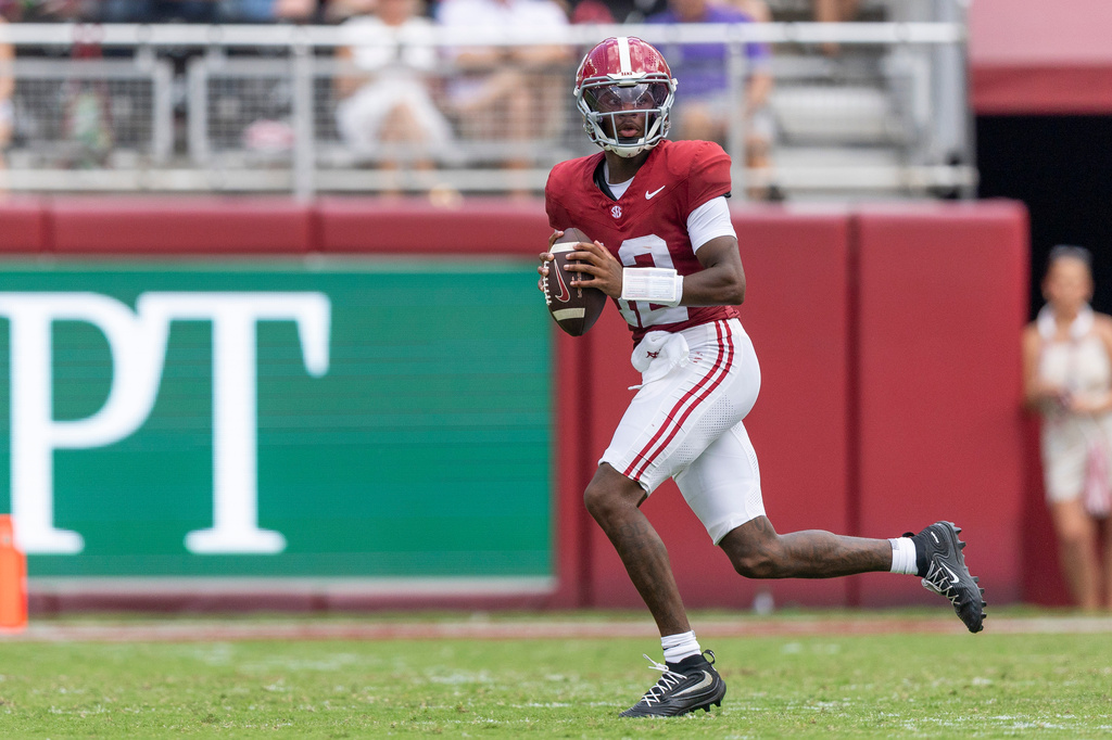 Alabama quarterback Keelon Russell (12) rolls out to throw against East Carolina during the first half of an NCAA college football game Saturday, Sept. 5, 2026, in Tuscaloosa, Ala. (AP Photo/Vasha Hunt)