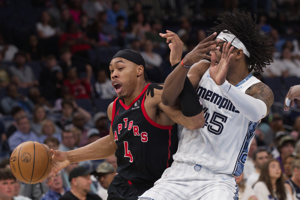 Toronto Raptors forward Scottie Barnes (4) dribbles while defended by Memphis Grizzlies forward GG Jackson II, right, during the first half of an NBA basketball game Friday, April 3, 2026, in Memphis, Tenn. (AP Photo/Nikki Boertman)