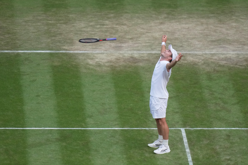 Arthur Fery of Britain celebrates winning against Grigor Dimitrov of Bulgaria in their fourth round men's singles match at the Wimbledon Tennis Championships in London, Monday, July 6, 2026. (AP Photo/Brian Inganga)