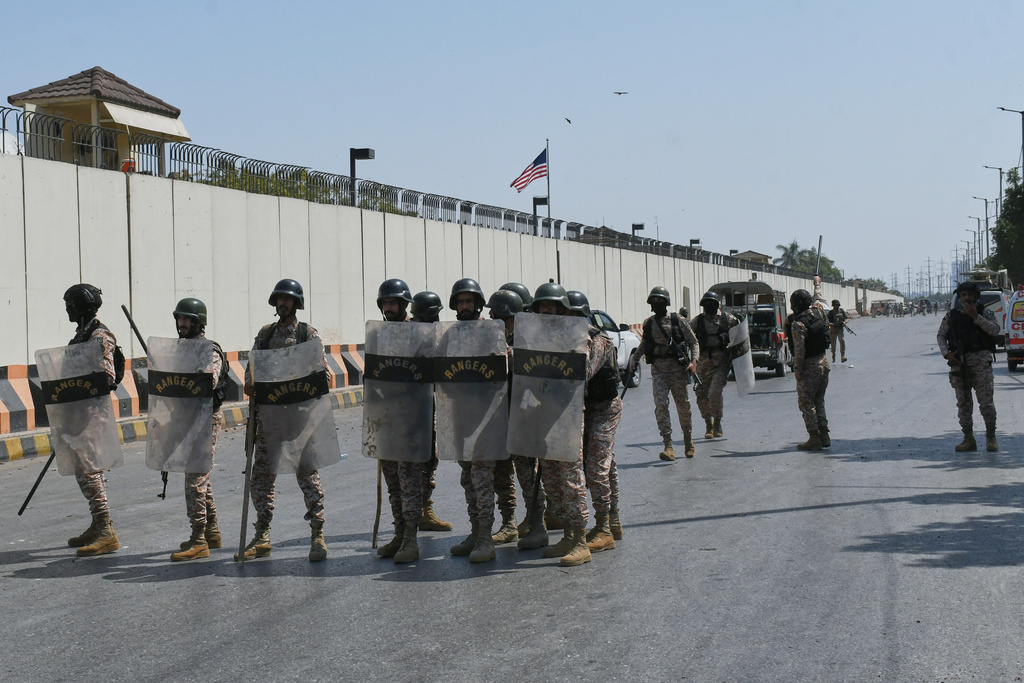 Paramilitary soldiers take positions at the U.S. Consulate after protesters stormed the building in Karachi, Pakistan, Sunday, March 1, 2026. (AP Photo/Ali Raza)