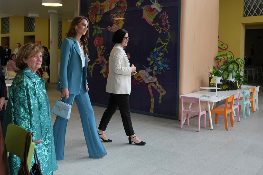 Britain's Kate, Princess of Wales, arrives at the Loris Malaguzzi International Centre and will take part in an immersive clay atelier workshop, part of a two-day trip, in Reggio Emilia, Italy, Wednesday, May 13, 2026. (AP Photo/Antonio Calanni, Pool)