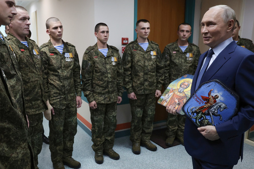 President Vladimir Putin holds Russian Orthodox icons as he meets with soldiers wounded in action in Ukraine, at the the Mandryk Central Military Clinical Hospital, in Moscow, Russia, Wednesday, Oct. 29, 2025. (Vyacheslav Prokofyev, Sputnik, Kremlin Pool Photo via AP) President Vladimir Putin holds Russian Orthodox icons as he meets with soldiers wounded in action in Ukraine, at the the Mandryk Central Military Clinical Hospital, in Moscow, Russia, Wednesday, Oct. 29, 2025. (Vyacheslav Prokofyev, Sputnik, Kremlin Pool Photo via AP)