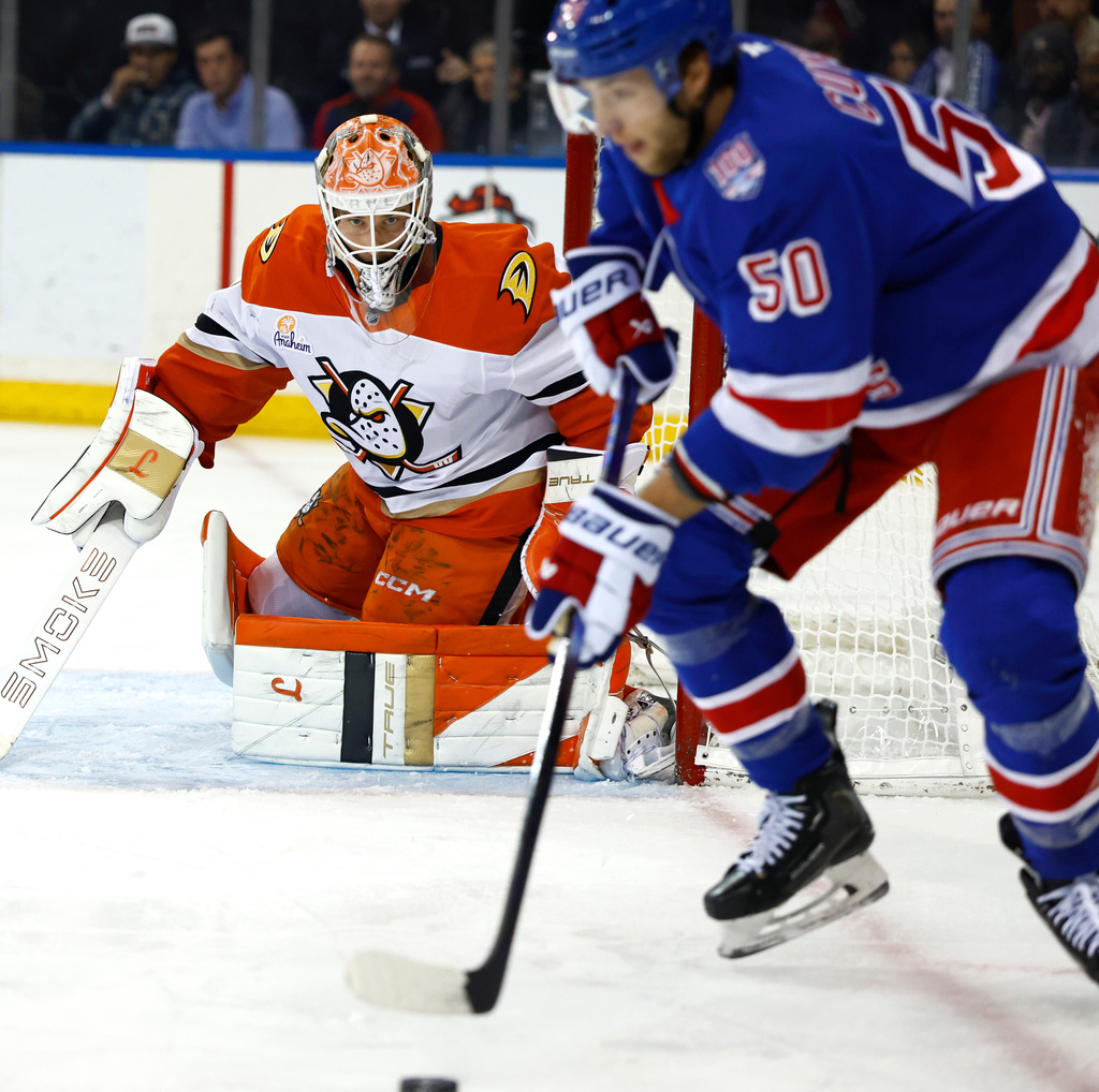 Anaheim Ducks goaltender Lukas Dostal (1) defends against New York Rangers left wing Will Cuylle (50) during the second period of an NHL hockey game, Monday, Dec 15, 2025, in New York. (AP Photo/Noah K. Murray)