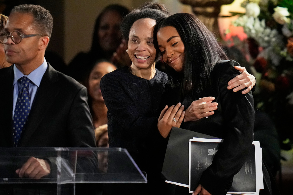 Jacqueline Lavinia "Jackie" Jackson embraces Ashley Jackson during the Homegoing Celebration of Life for the Rev. Jesse Jackson, Saturday, March 7, 2026, at Rainbow PUSH Coalition headquarters in Chicago. (AP Photo/Erin Hooley)