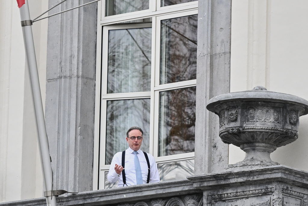 Belgium's Prime Minister Bart De Wever stands on the balcony of his office one day ahead of an EU leaders summit in Brussels, Wednesday, Dec. 17, 2025. (AP Photo/Harry Nakos)