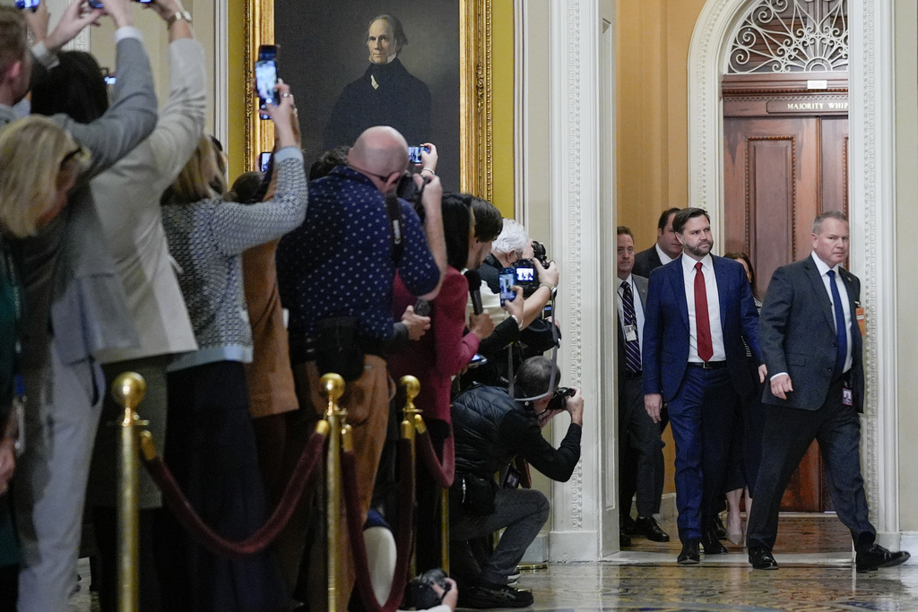 Vice President JD Vance, center, arrives for a Senate Republican Conference luncheon at the U.S. Capitol on day 28 of the government shutdown, Tuesday, Oct. 28, 2025, in Washington. (AP Photo/Mariam Zuhaib)