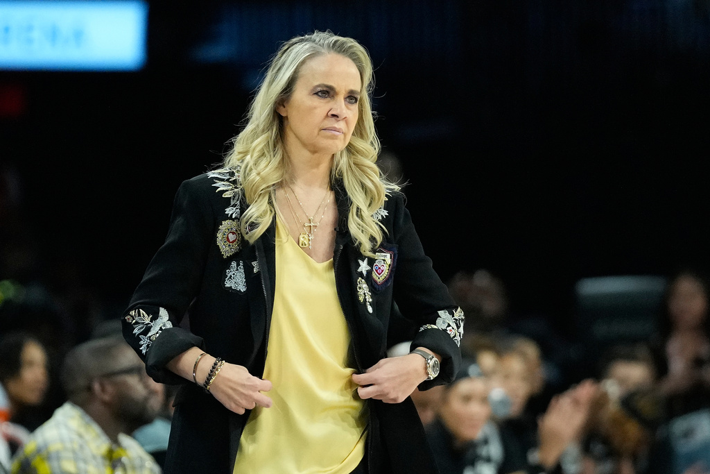 Las Vegas Aces head coach Becky Hammon looks on during the second half in Game 2 of the WNBA basketball finals against the Phoenix Mercury, Sunday, Oct. 5, 2025, in Las Vegas. (AP Photo/John Locher)