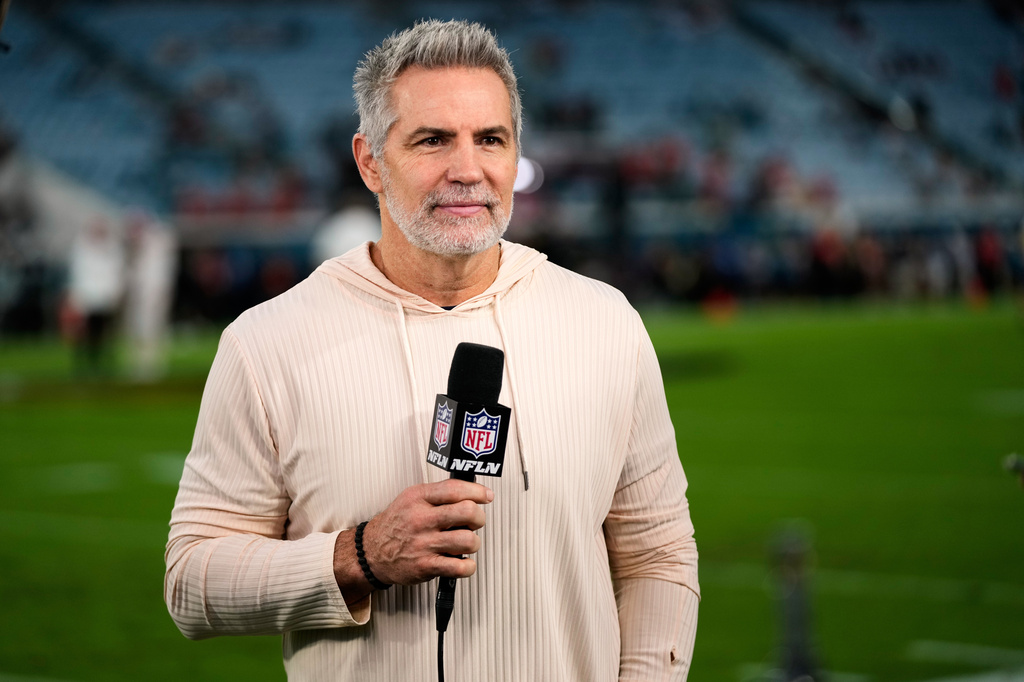FILE - NFL Network analyst Kurt Warner reports before an NFL football game between the Jacksonville Jaguars and the Kansas City Chiefs, Oct. 6, 2025, in Jacksonville, Fla. (AP Photo/John Raoux, File)