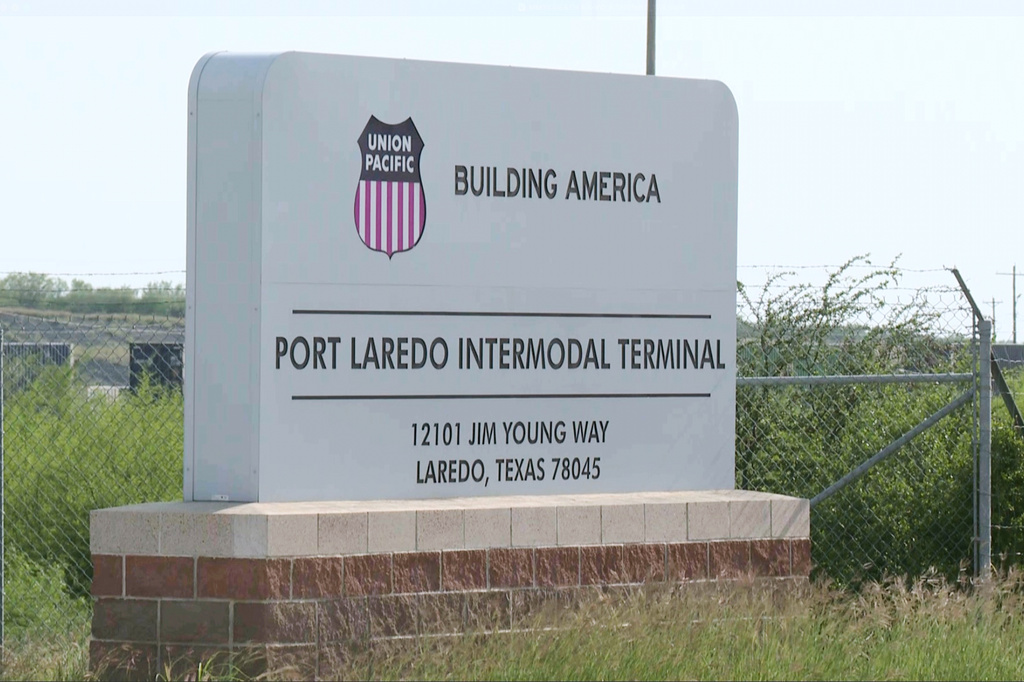 In this image taken from video footage provided by KGNS, the Port Laredo Intermodal Terminal sign stands outside a rail yard in Laredo, Texas, Sunday, May 10, 2026. (KGNS via AP)