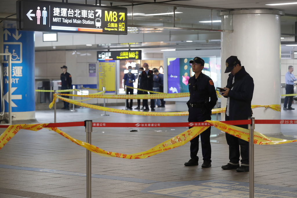 Taiwan police cordoned off the scene after a knife attack in Taipei, Taiwan, Friday, Dec. 19, 2025. (AP Photo/Chiang Ying-ying)