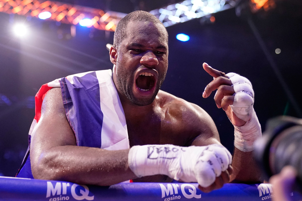 Britain's Daniel Dubois celebrates after beating Britain's Fabio Wardley in a WBO World Heavyweight boxing title bout in Manchester, Saturday, May 9, 2026. (AP Photo/Dave Thompson)