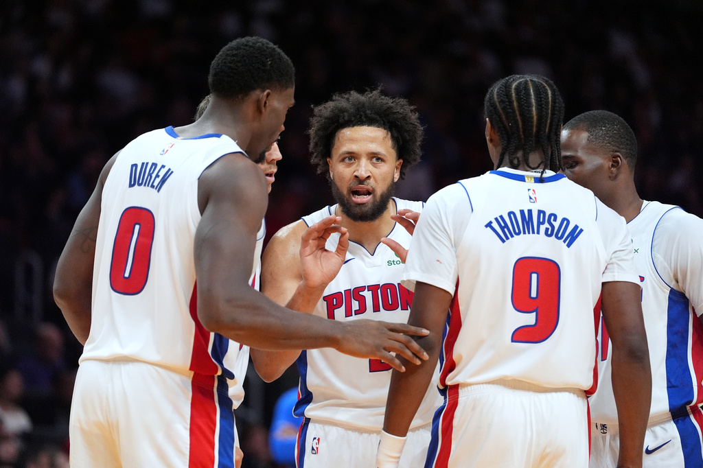 Detroit Pistons guard Cade Cunningham (2) talks with teammates during the first half of an NBA basketball game against the Miami Heat, Friday, Oct. 23, 2026, in Miami. (AP Photo/Rebecca Blackwell)