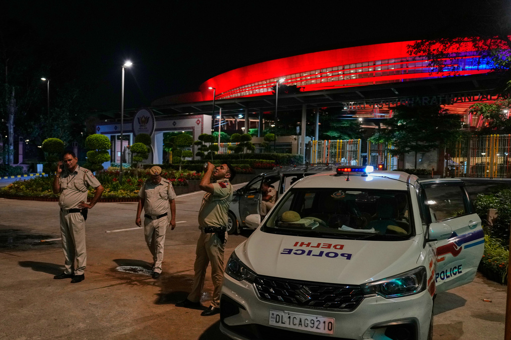Delhi police personnel stand guard outside the illuminated Bharat Mandapam, the venue for the BRICS summit, in New Delhi, India, Thursday, Sept. 10, 2026. (AP Photo/Manish Swarup)