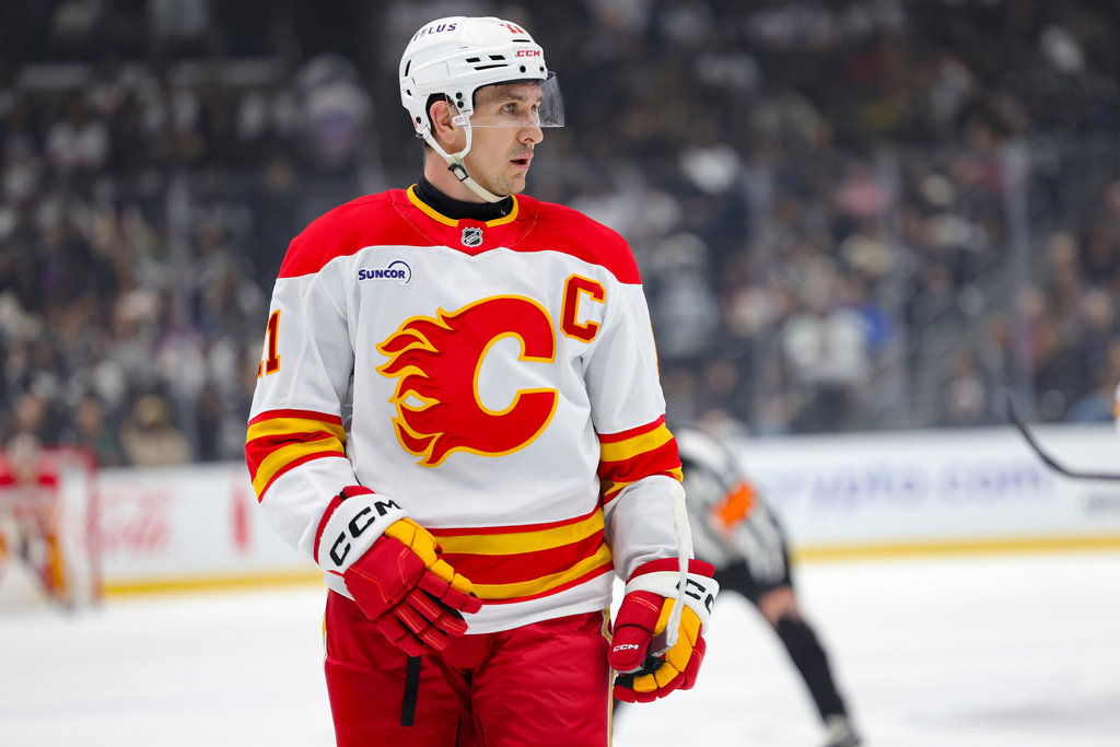 Calgary Flames center Mikael Backlund stands during a face off during the first period of an NHL hockey game against the Los Angeles Kings Saturday, Feb. 28, 2026 in Los Angeles. (AP Photo/Ryan Sun)