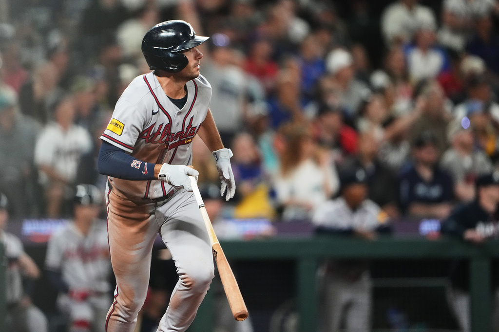 Atlanta Braves' Matt Olson watches his solo home run against the Seattle Mariners during the ninth inning of a baseball game, Tuesday, May 5, 2026, in Seattle. (AP Photo/Lindsey Wasson)