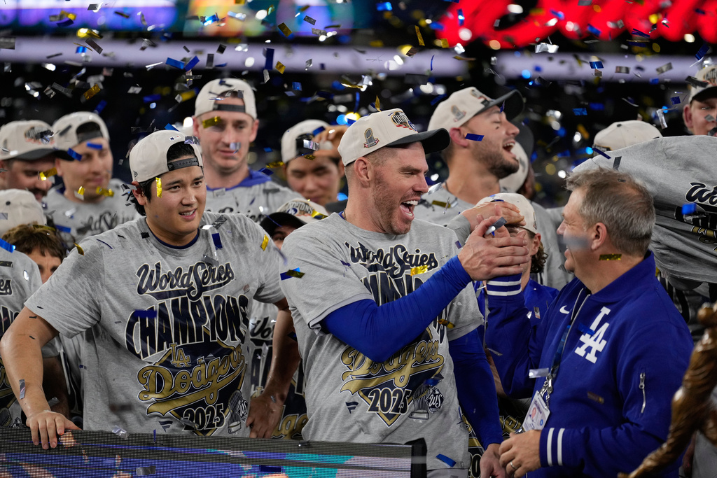 Los Angeles Dodgers pitcher Shohei Ohtani and first baseman Freddie Freeman celebrate after their win against the Toronto Blue Jays in Game 7 of baseball's World Series, Sunday, Nov. 2, 2025, in Toronto. (AP Photo/Brynn Anderson)