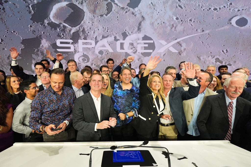 Gwynne Shotwell, President and COO of SpaceX, third from right, celebrates with colleagues during a bell ringing ceremony for the IPO of SpaceX at the Nasdaq MarketSite in New York, Friday, June 12, 2026, in New York. (AP Photo/Frank Franklin II)