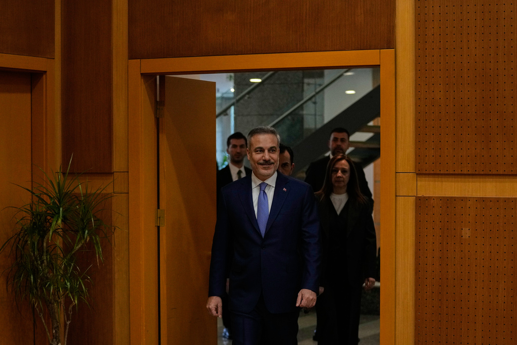 Turkey's Foreign Minister Hakan Fidan arrives prior to an interview with The Associated Press, in Ankara, Turkey, Saturday, March 14, 2026. (AP Photo/Khalil Hamra)