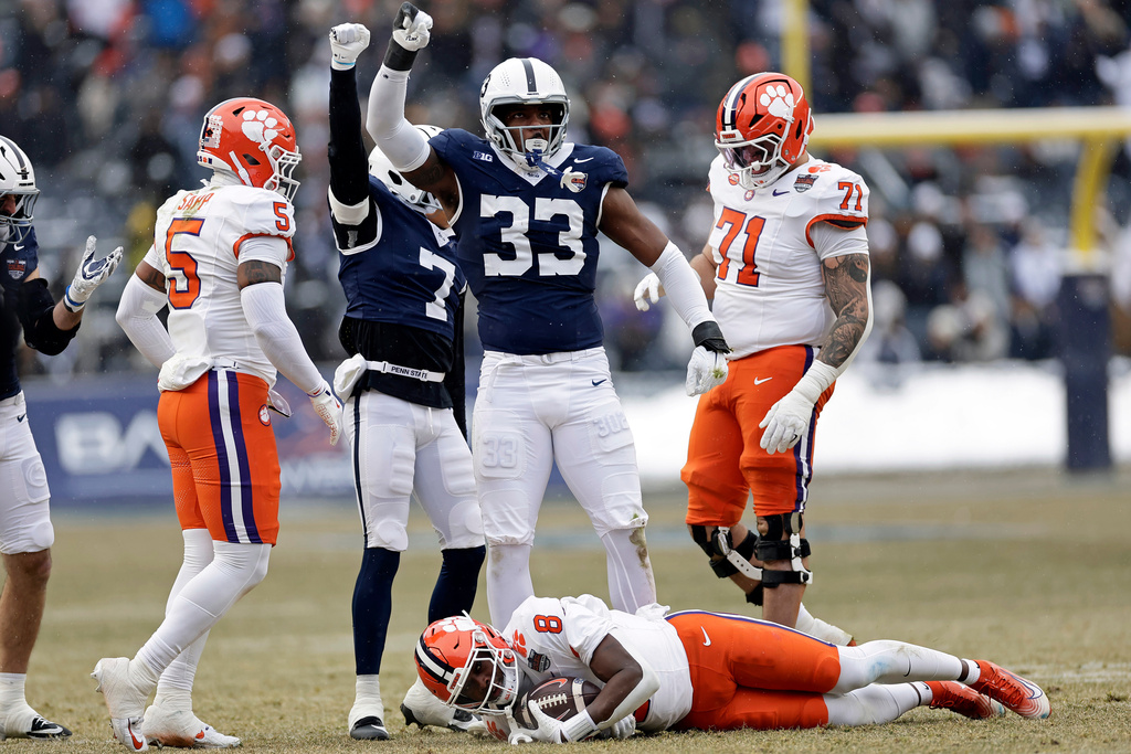 Penn State defensive end Dani Dennis-Sutton (33) reacts after tackling Clemson running back Adam Randall (8) during the first half of the Pinstripe Bowl NCAA college football game at Yankee Stadium Saturday, Dec. 27, 2025, in New York. (AP Photo/Adam Hunger)