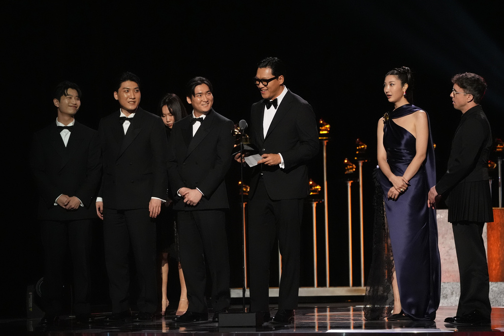 The team from KPop Demon Hunters accept the award for best song written for visual media for "Golden" during the 68th annual Grammy Awards on Sunday, Feb. 1, 2026, in Los Angeles. (AP Photo/Chris Pizzello)
