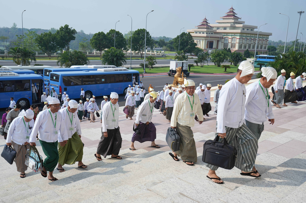 Myanmar lawmakers arrive to attend a session at Union Parliament in Naypyitaw, Myanmar, Thursday, April 9, 2026. (AP Photo/Aung Shine Oo)