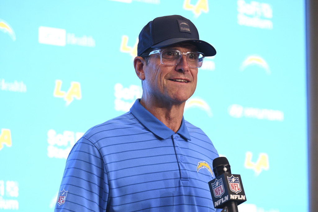 Los Angeles Chargers head coach Jim Harbaugh answers questions after an NFL football game against the Denver Broncos, Sunday, Sept. 21, 2025, in Inglewood, Calif. (AP Photo/Carrie Giordano)