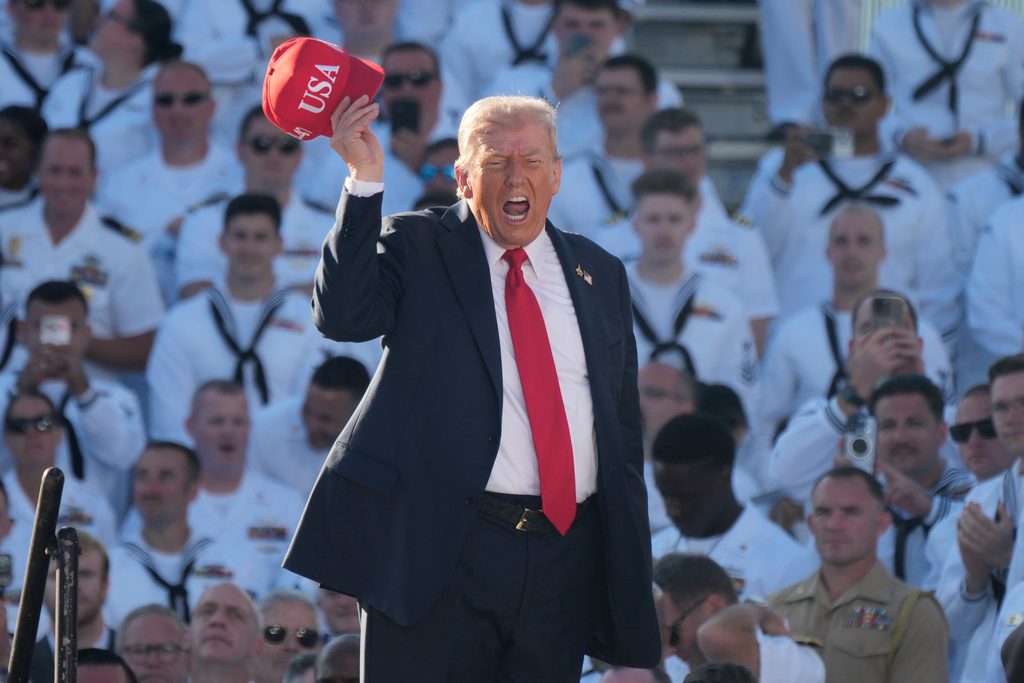President Donald Trump arrives to speak during a celebration for the 250th anniversary of the U.S. Navy aboard the USS Harry S. Truman at Naval Station Norfolk, Sunday Oct. 5, 2025 in Norfolk, Va. (AP Photo/Steve Helber)