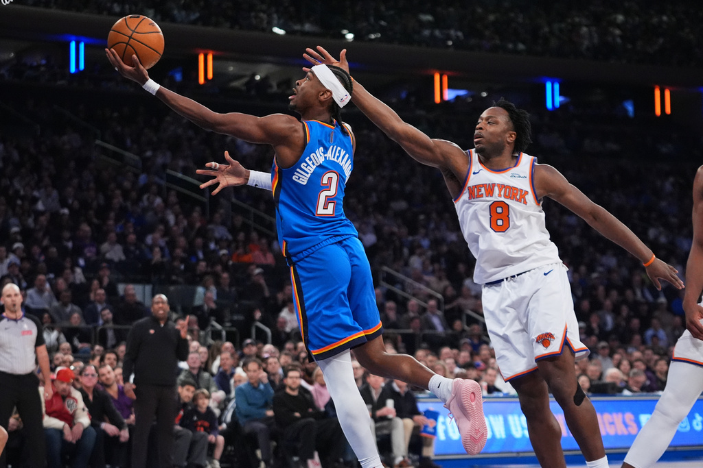 Oklahoma City Thunder's Shai Gilgeous-Alexander (2) drives past New York Knicks' Og Anunoby (8) during the first half of an NBA basketball game Wednesday, March 4, 2026, in New York. (AP Photo/Frank Franklin II)