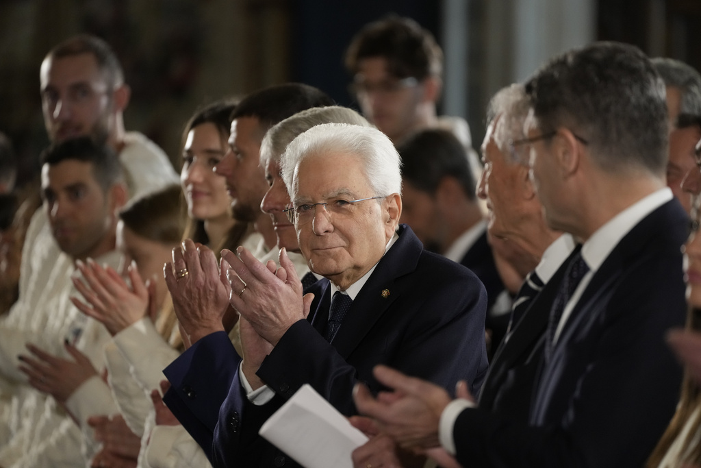 Italian by the Italian President Sergio Mattarella applauds during the hand over ceremony of the Italian flag for the Milan-Cortina Winter Olympic games, at the Quirinale Presidential palace, in Rome, Monday, Dec. 22, 2025. (AP Photo/Gregorio Borgia)