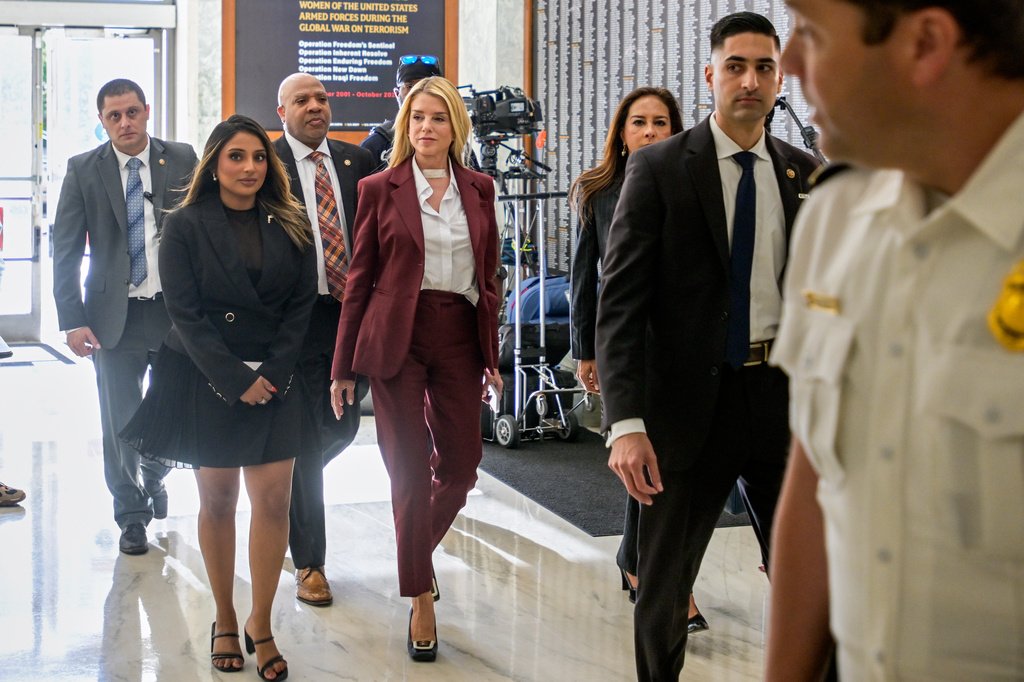 Former Attorney General Pam Bondi, center, arrives for her deposition at the Rayburn House Office Building on Capitol Hill, Friday, May 29, 2026, in Washington. (AP Photo/Rod Lamkey, Jr.)