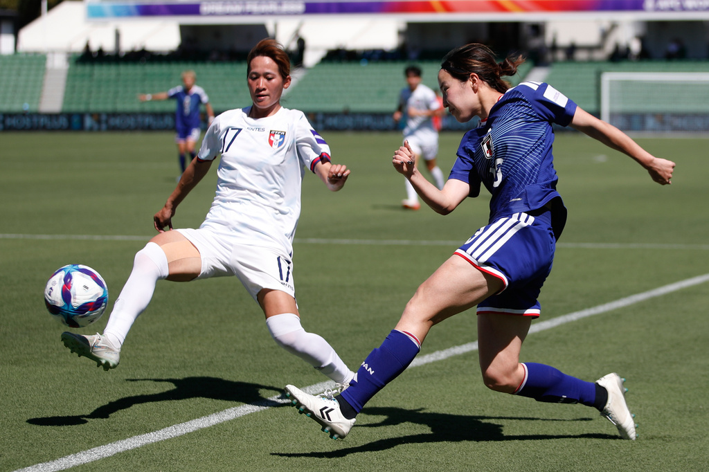 Japan's Hikaru Kitagawa, right, and Taiwan's Chen Jin-wen compete for the ball during the Women's Asia Cup soccer match between Japan and Taiwan in Perth, Wednesday, March 4, 2026. (AP Photo/GaryDay)