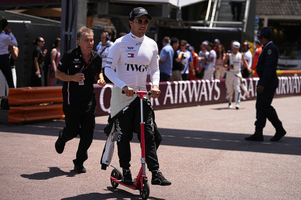Cadillac driver Sergio Perez of Mexico arrives at the pits prior to the start of the Formula One Monaco Grand Prix race at the Monaco racetrack, Sunday, June 7, 2026. (AP Photo/Fatima Shbair)