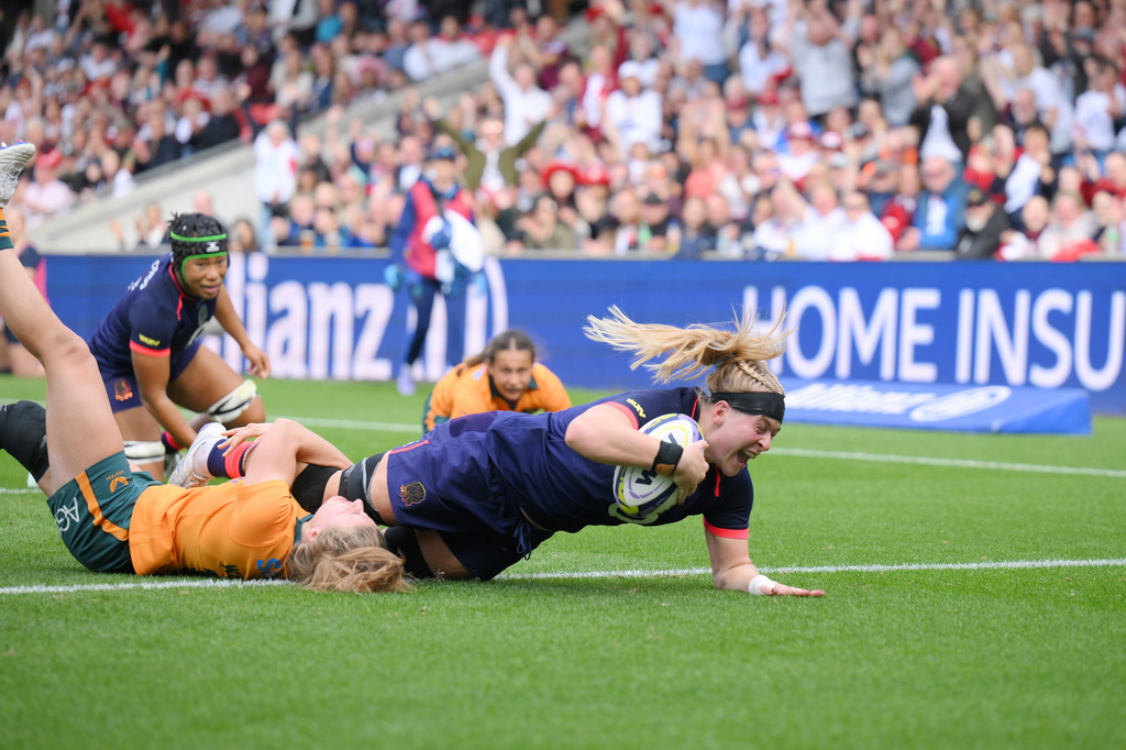 England's Abi Burton scores a try during the WXV Global Series women's rugby union match between England and Australia in Salford, England, Saturday Sept. 12, 2026. (Gary Oakley/PA via AP)