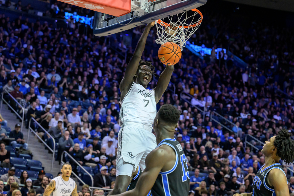 UCF center John Bol (7) dunks during the second half an NCAA college basketball game against BYU, Tuesday, Feb. 24, 2026, in Provo, Utah. (AP Photo/Tyler Tate)
