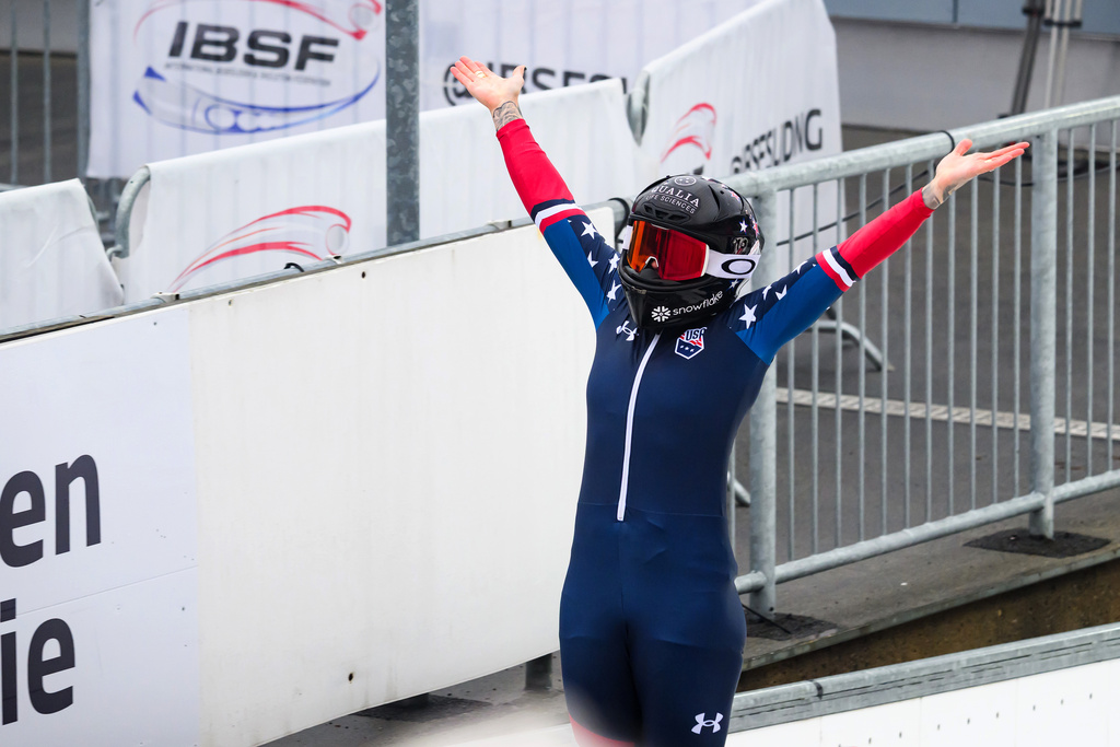 Winner Kaillie Armbruster Humphries of the U.S. celebrates her victory in the monobob, women, 2nd run, competition of the Bobsleigh World Cup, in Altenberg, Germany, Saturday Jan. 17, 2026. (Robert Michael/dpa via AP)