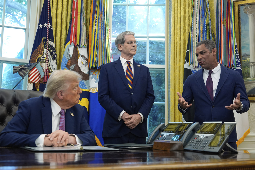 President Donald Trump listens as Miami Mayor Francis Suarez speaks in the Oval Office of the White House, Friday, Sept. 5, 2025, in Washington, as Treasury Secretary Scott Bessent listens. (AP Photo/Alex Brandon)