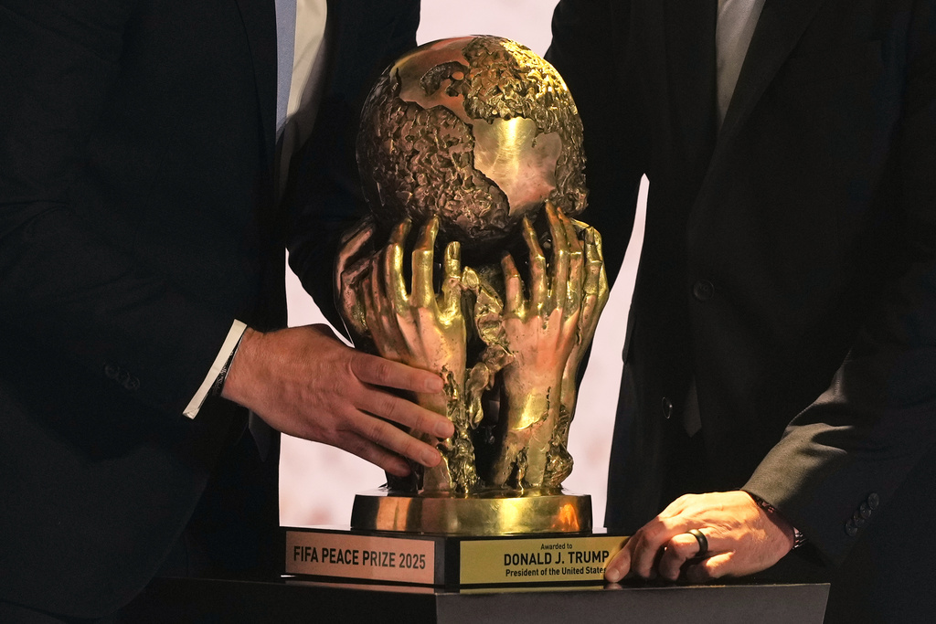 The FIFA Peace Prize is placed on a pedestal before being awarded to President Donald Trump during the draw for the 2026 soccer World Cup at the Kennedy Center in Washington, Friday, Dec. 5, 2025. (AP Photo/Stephanie Scarbrough, Pool)