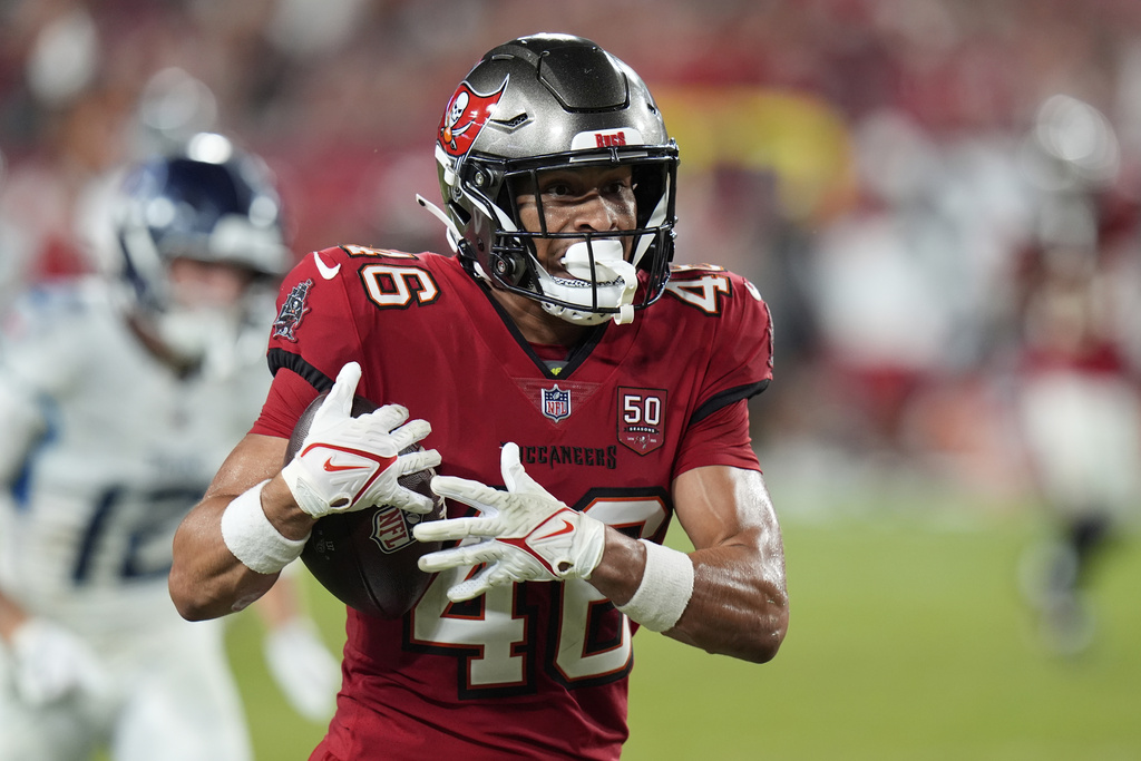 Tampa Bay Buccaneers cornerback Roman Parodie intercepts a pass and returns it jar,for a touchdown against the Tennessee Titans during the second half of an NFL preseason football game on Saturday, Aug. 9, 2025, in Tampa, Fla. (AP Photo/Chris O'Meara)