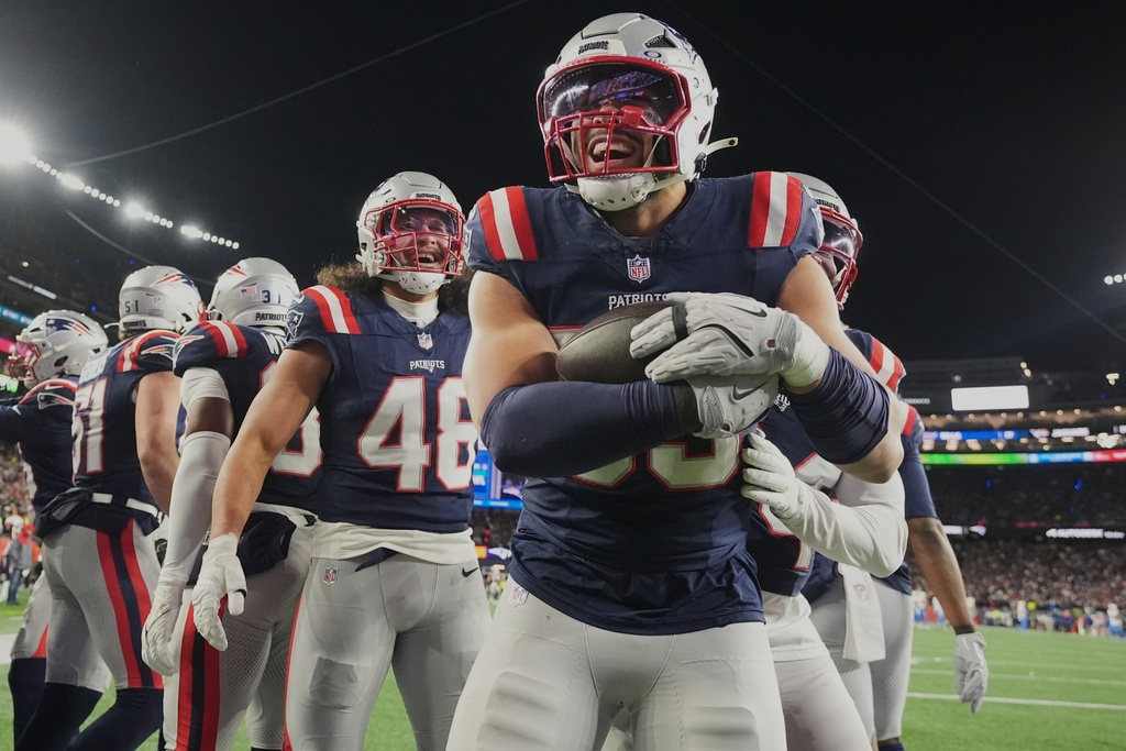 New England Patriots linebacker Christian Elliss celebrates after recovering a fumble by Los Angeles Chargers quarterback Justin Herbert in the second half of an NFL wild-card playoff football game in Foxborough, Mass., Sunday, Jan. 11, 2026. (AP Photo/Charles Krupa)
