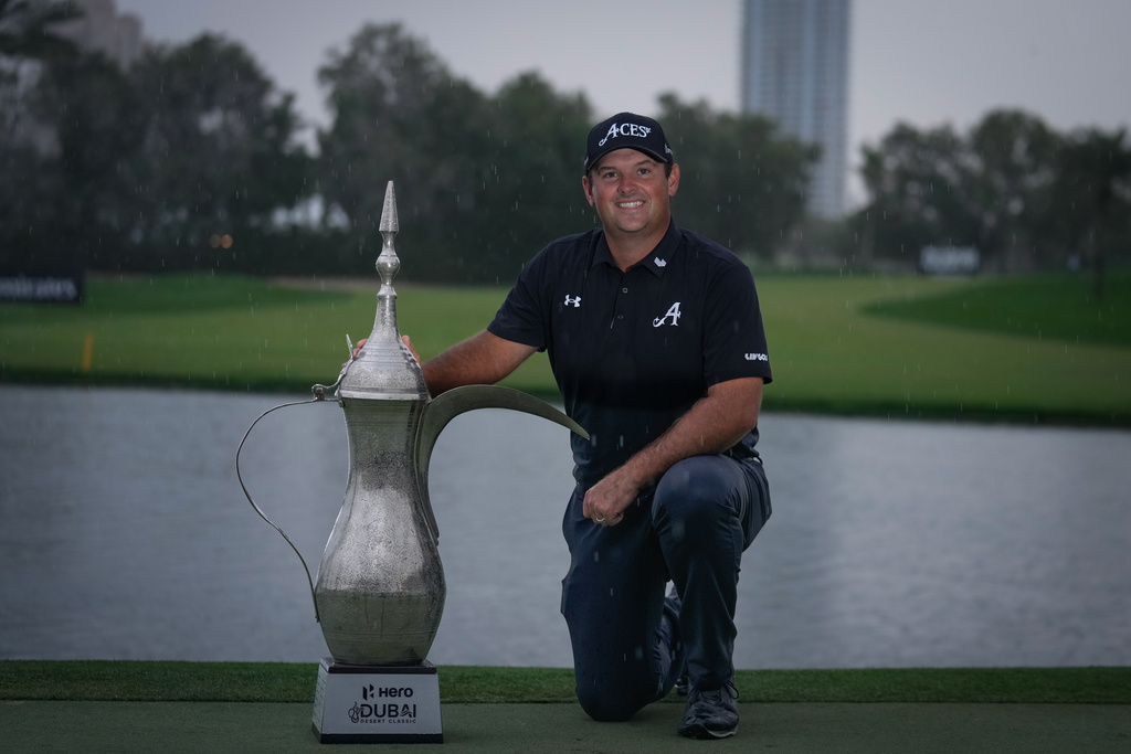 Winner Patrick Reed of the United States poses with the Dubai Desert Classic in United Arab Emirates, Sunday, Jan. 25, 2026. (AP Photo/Altaf Qadri)