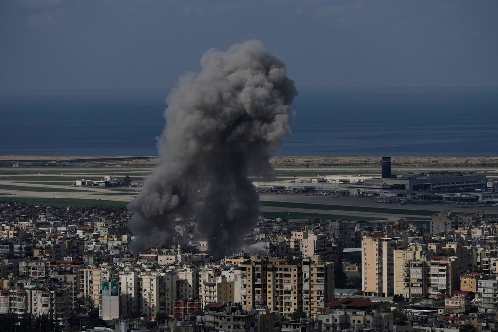 Smoke rises following an Israeli airstrike in Dahiyeh, Beirut's southern suburb, near Rafik Hariri International Airport, Lebanon, Wednesday, March 4, 2026. (AP Photo/Bilal Hussein)