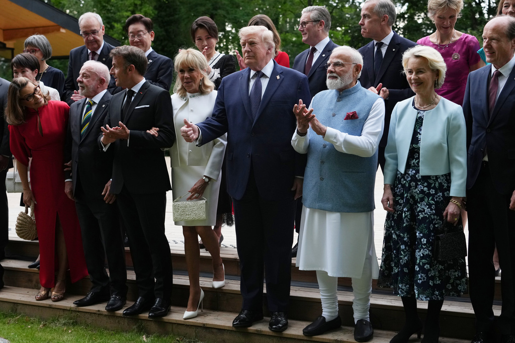U.S. President Donald Trump and other leaders pose during a group photo of leaders at the G7 summit, Tuesday, June 16, 2026, in Evian-les-Bains, France. (AP Photo/Julia Demaree Nikhinson)
