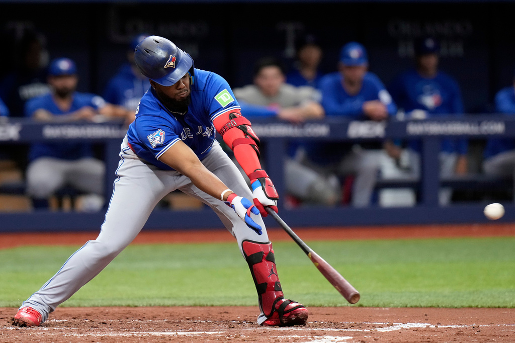 Toronto Blue Jays' Vladimir Guerrero Jr. connects for an RBI single off Tampa Bay Rays pitcher Nick Martinez during the third inning of a baseball game Monday, May 4, 2026, in St. Petersburg, Fla. (AP Photo/Chris O'Meara)