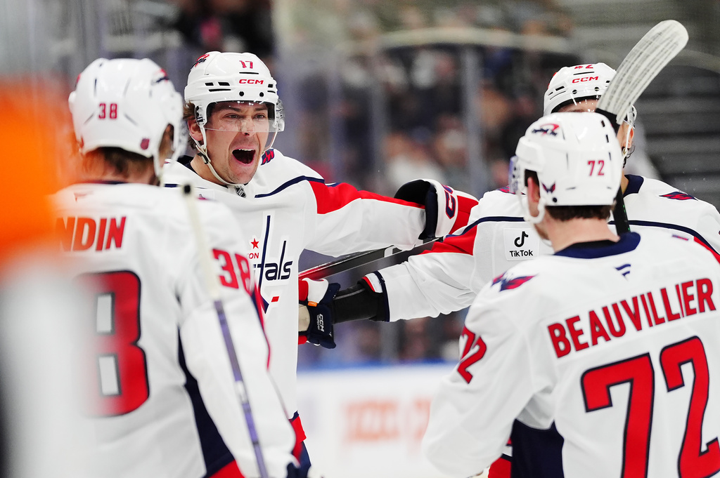 Washington Capitals' Dylan Strome, second from left, celebrates his goal against the Toronto Maple Leafs with teammates during first period NHL hockey action in Toronto on Wednesday, April 8, 2026. (Frank Gunn/The Canadian Press via AP)