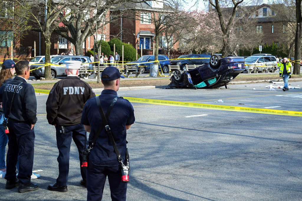 FILE - This image provided by the Office of the New York Mayor shows the scene, March 29, 2025, in the Brooklyn borough of New York, where a woman driving on a suspended license was speeding and failed to yield after stopping at a red light, collided with another vehicle and then into a family walking on the crosswalk. (Mayoral Photography Office/Justin Persaud via AP, File)