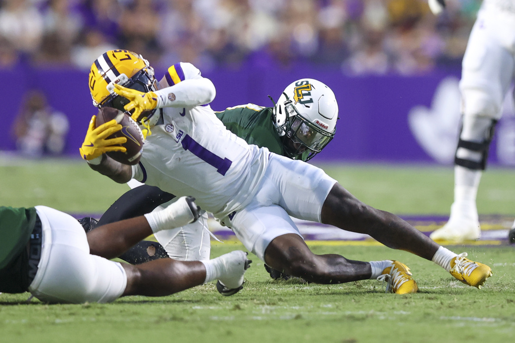 LSU wide receiver Aaron Anderson (1) stretches for some extra yardage in the first half of an NCAA college football game against Southeastern Louisiana in Baton Rouge, La., Saturday, Sept. 20, 2025. (AP Photo/Peter Forest)