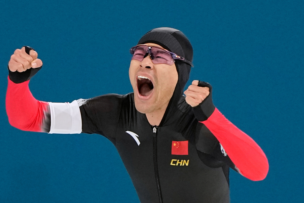 Ning Zhongyan of China celebrates after his men's 1500 meters speedskating race at the 2026 Winter Olympics, in Milan, Italy, Thursday, Feb. 19, 2026. (AP Photo/Ben Curtis)